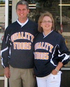 Pat & Amy Riesberg stand in front of Quality Foods