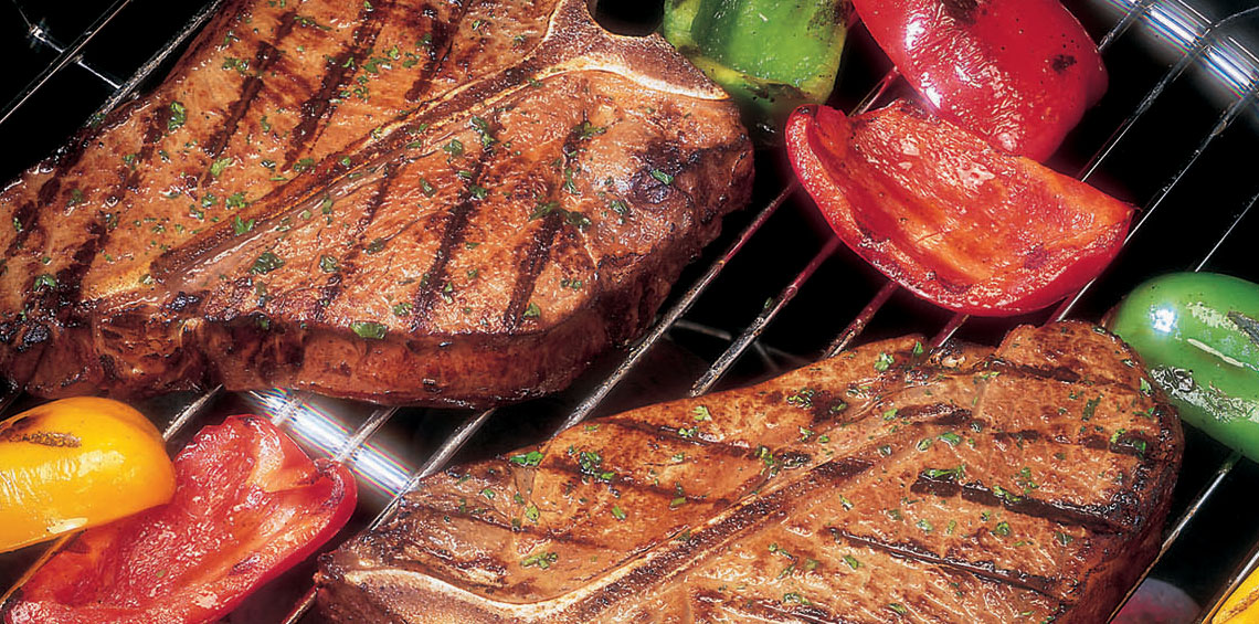 steaks and peppers on the grill